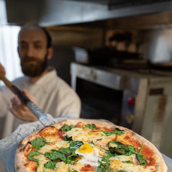 Fresh pizza being prepared at Horse & Wig in Holborn